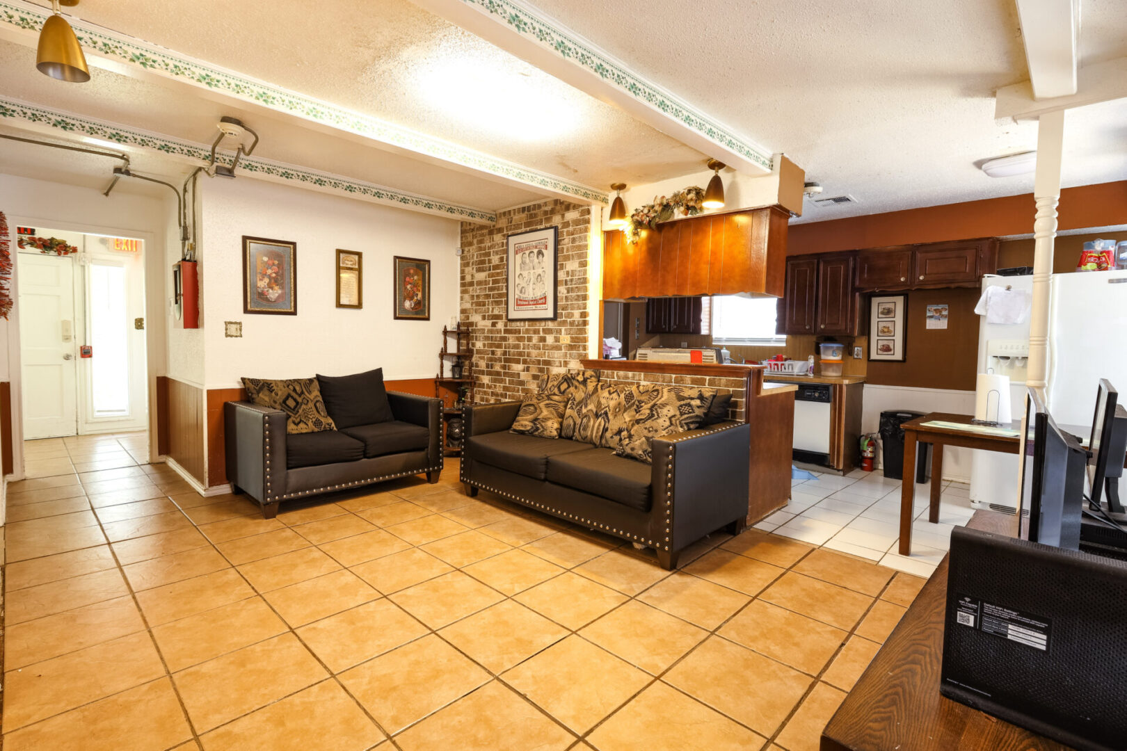 Cozy living room with stone accent wall and modern furniture.